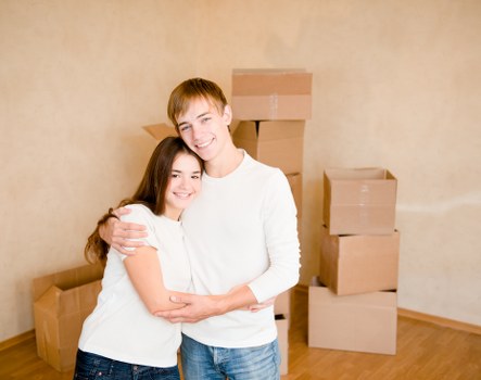 Professional team handling office furniture and boxes during a business move