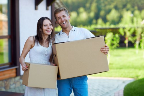 Moving van and packed boxes outside an Irish home during relocation