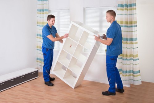 Manager checking removal service records for issue resolution