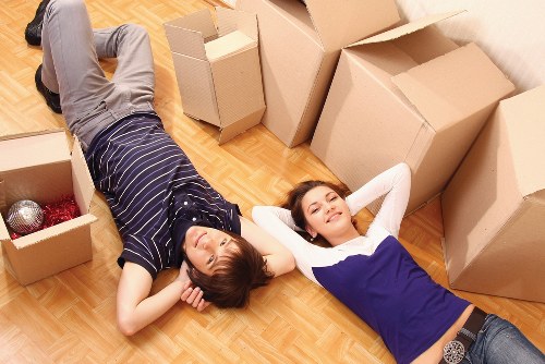 Professional movers loading furniture for transport