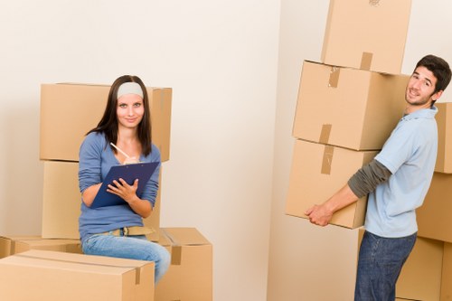 Prepared furniture removal team loading items for pick-up